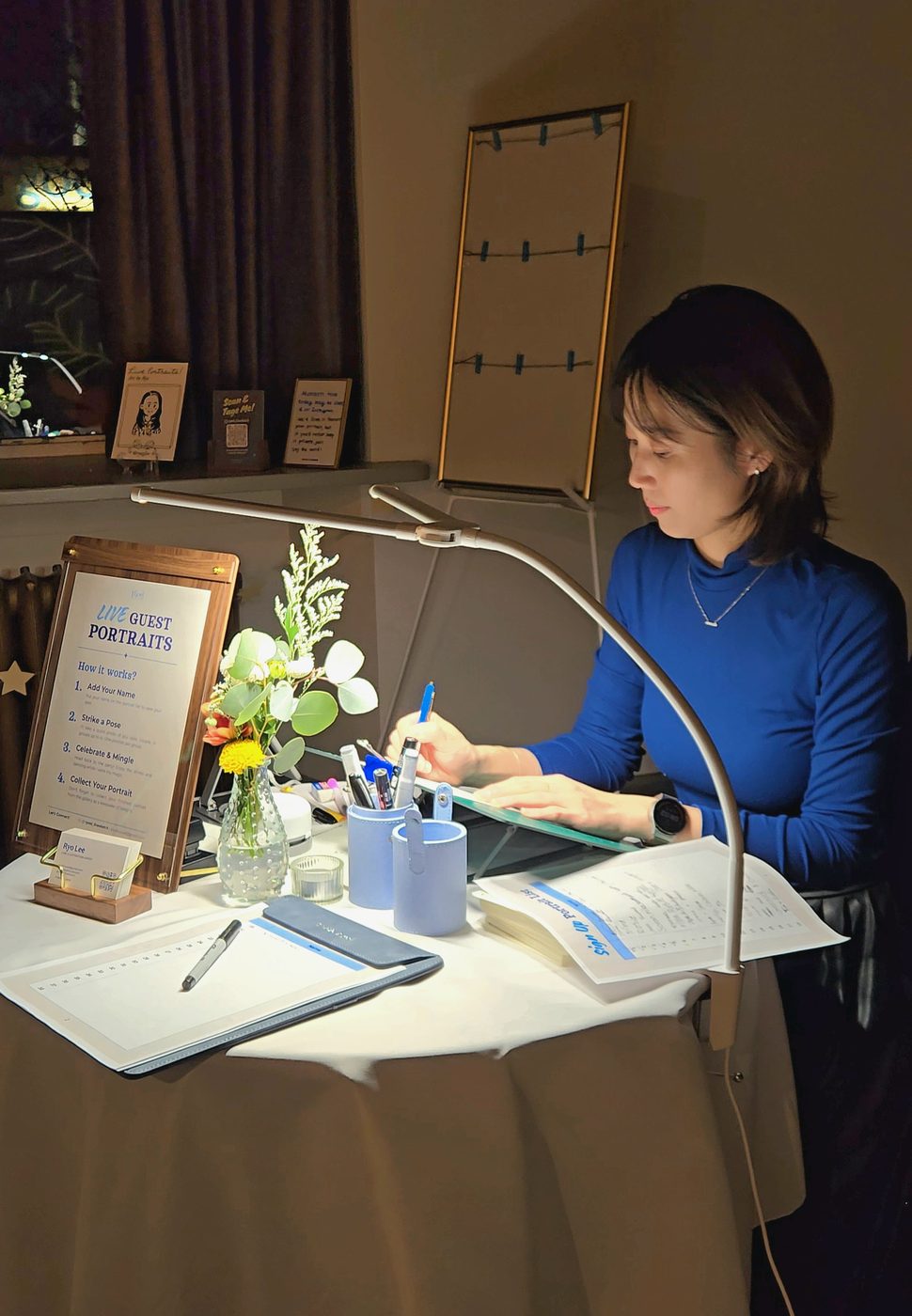 Ryo drawing guest portraits at a Vancouver event